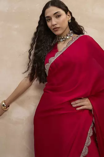 Red women sequinned border satin saree
