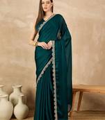 Green sequinned satin saree