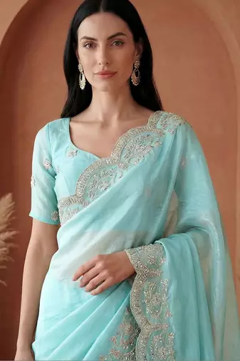 Turquoise embroidered tissue saree