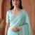 Turquoise embroidered tissue saree