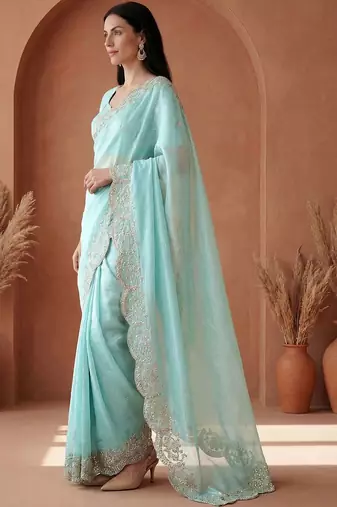 Turquoise embroidered tissue saree
