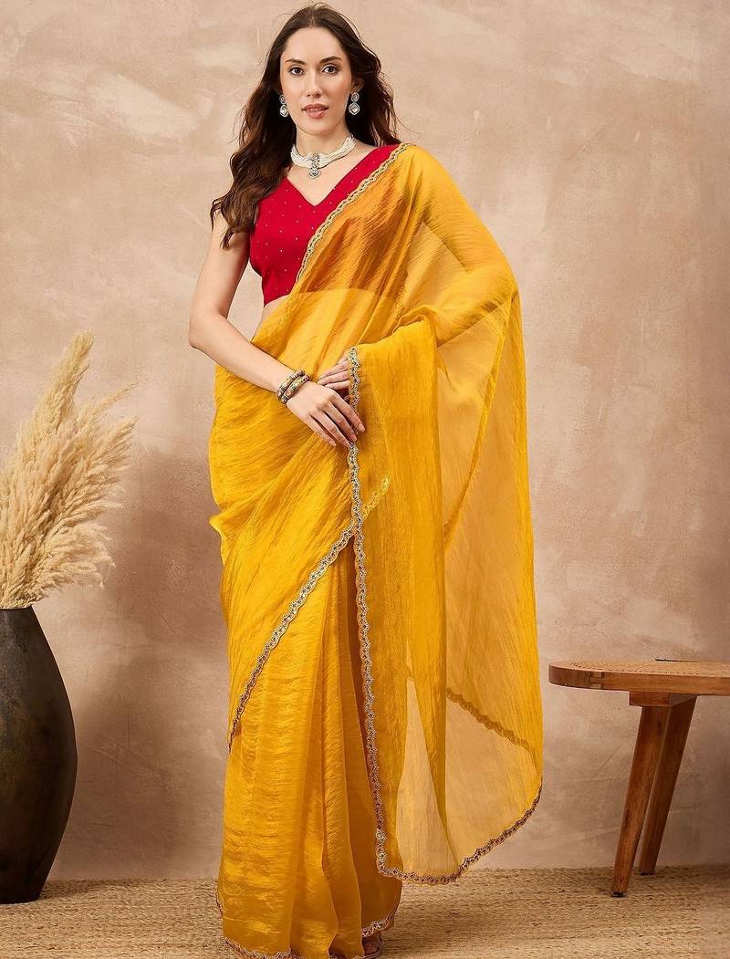 Yellow embellished siquinned border organza saree with unstitched blouse piece