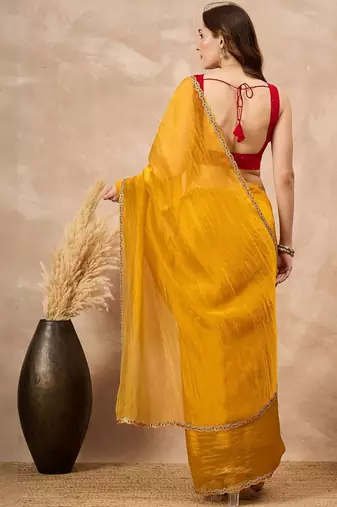 Yellow embellished siquinned border organza saree with unstitched blouse piece