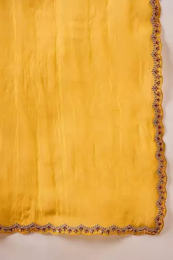 Yellow embellished siquinned border organza saree with unstitched blouse piece