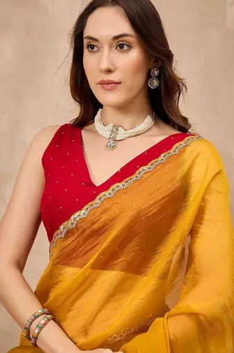 Yellow embellished siquinned border organza saree with unstitched blouse piece