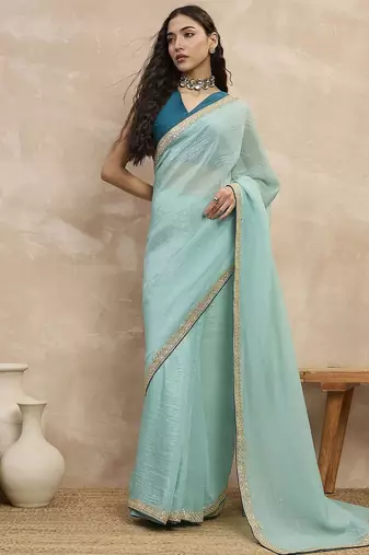 Turquoise sequinned organza designer saree