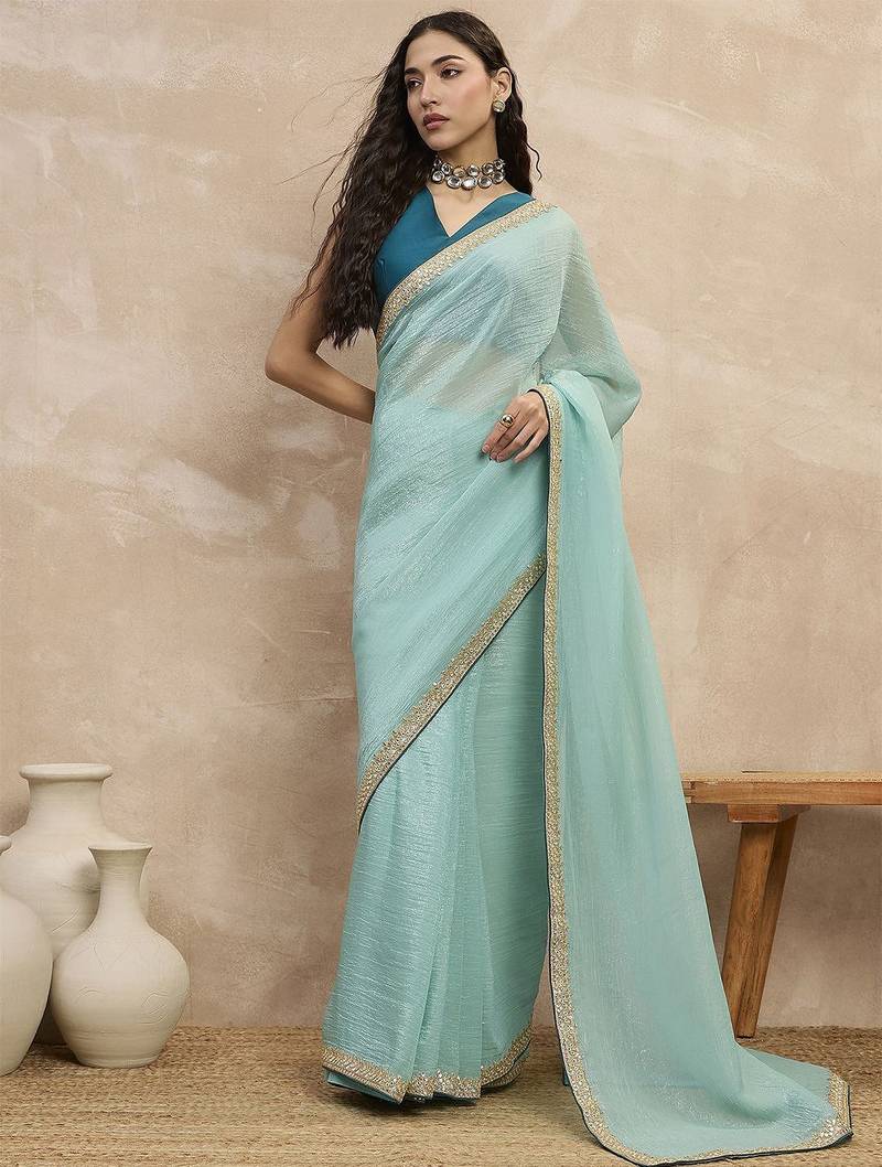 Turquoise sequinned organza designer saree