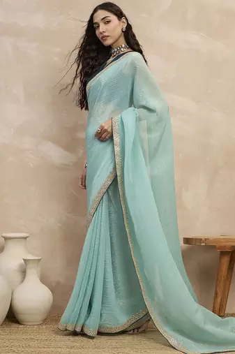 Turquoise sequinned organza designer saree