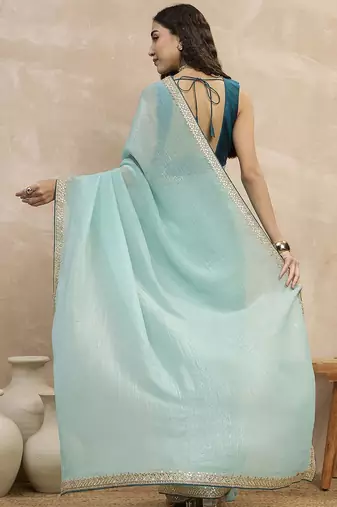 Turquoise sequinned organza designer saree