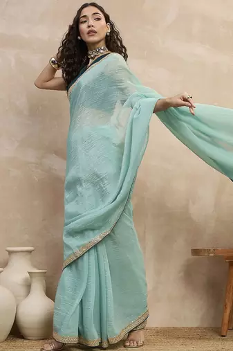 Turquoise sequinned organza designer saree