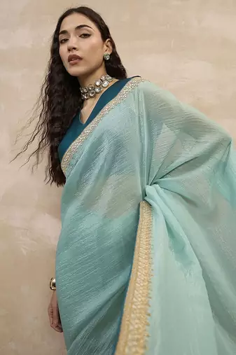 Turquoise sequinned organza designer saree