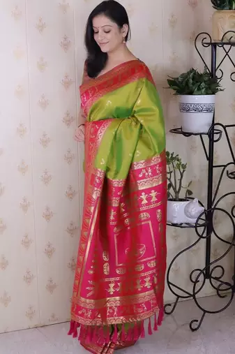 Green ethnic motifs zari silk blend banarasi saree