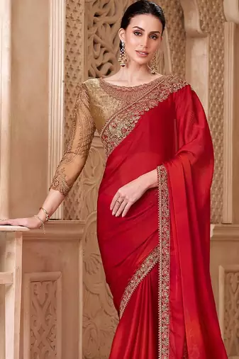 Red ethnic motifs embroidered satin heavy work saree