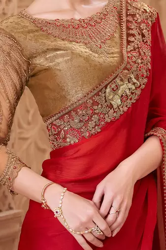 Red ethnic motifs embroidered satin heavy work saree