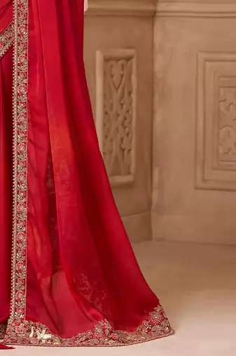 Red ethnic motifs embroidered satin heavy work saree