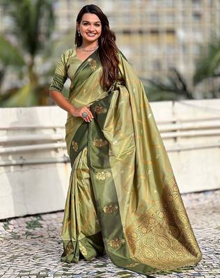 Green ethnic motifs woven design zari banarasi saree with tasseled 1