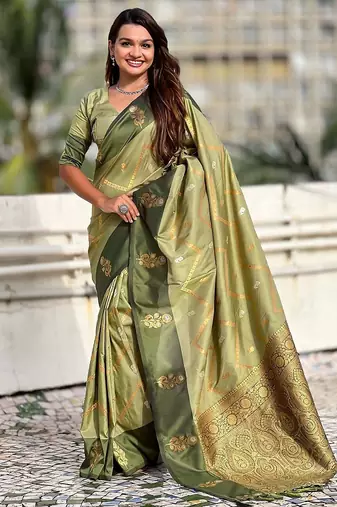 Green ethnic motifs woven design zari banarasi saree with tasseled