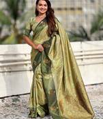 Green ethnic motifs woven design zari banarasi saree with tasseled