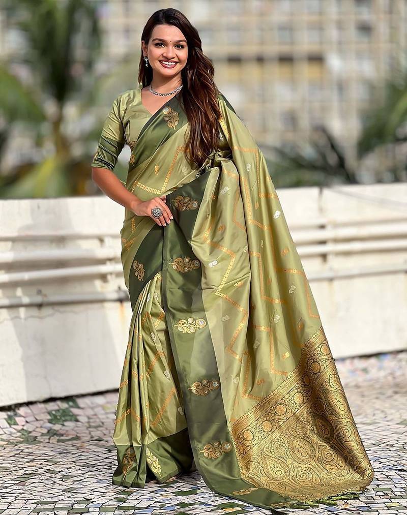 Green ethnic motifs woven design zari banarasi saree with tasseled