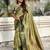 Green ethnic motifs woven design zari banarasi saree with tasseled