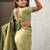 Green ethnic motifs woven design zari banarasi saree with tasseled