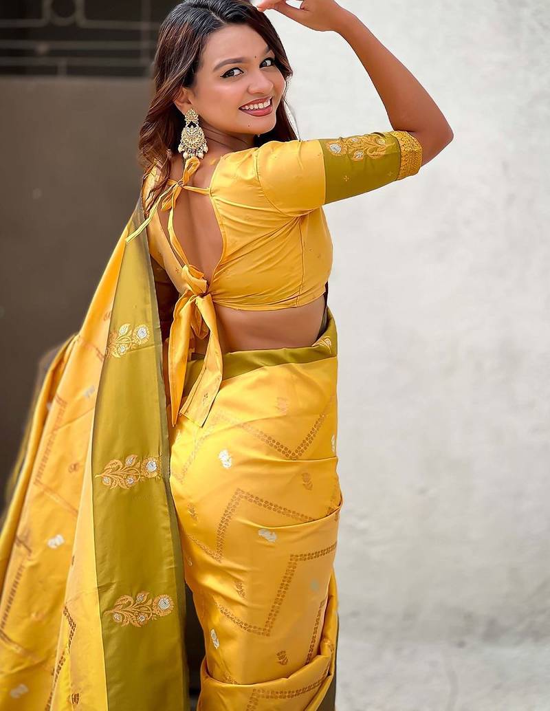 Yellow woven design zari silk blend banarasi saree