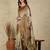 Beige women ethnic motifs  kasavu saree