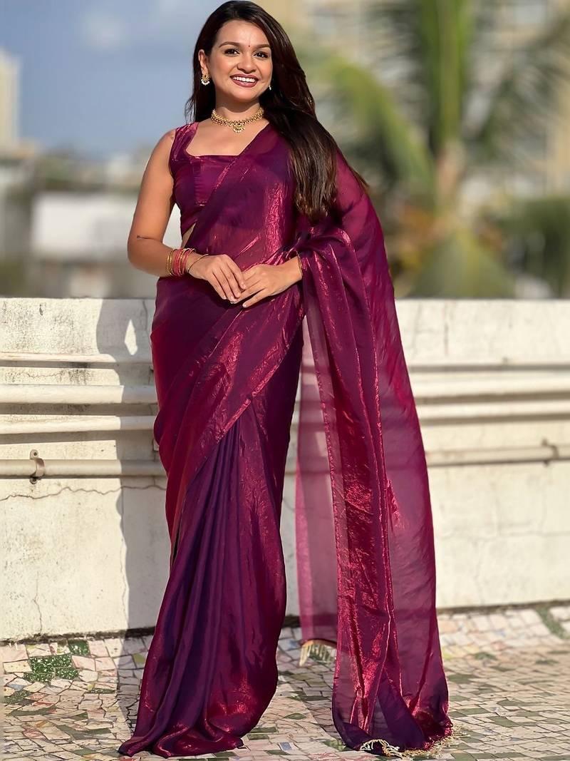Purple shimmer satin tissue saree with golden tassels