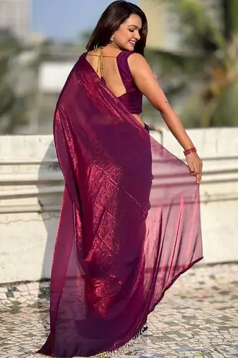Purple shimmer satin tissue saree with golden tassels