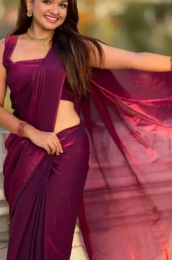 Purple shimmer satin tissue saree with golden tassels