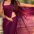 Purple shimmer satin tissue saree with golden tassels