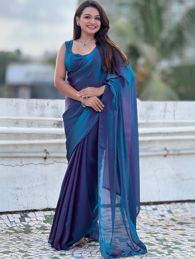 Blue blue shimmer satin tissue saree with golden tassels
