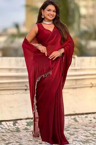 Maroon red shimmer satin tissue saree with golden tassels