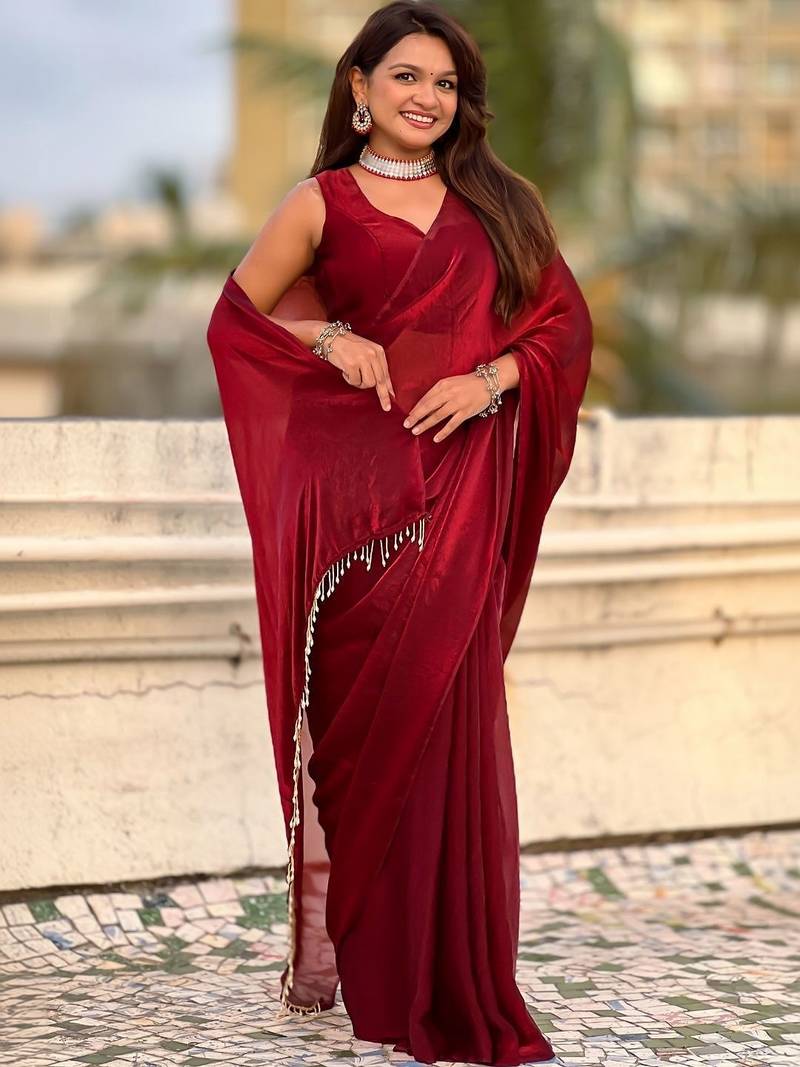 Maroon red shimmer satin tissue saree with golden tassels