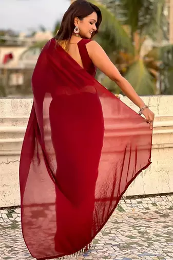 Maroon red shimmer satin tissue saree with golden tassels