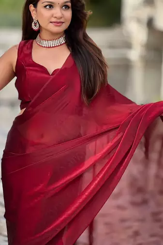 Maroon red shimmer satin tissue saree with golden tassels