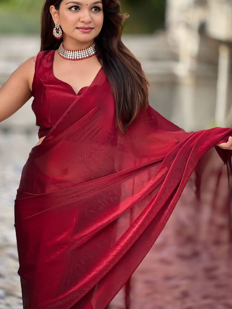 Maroon red shimmer satin tissue saree with golden tassels