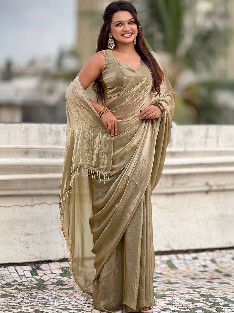 Olive golden beige shimmer satin tissue saree with golden tassels