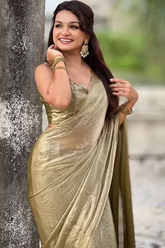 Olive golden beige shimmer satin tissue saree with golden tassels