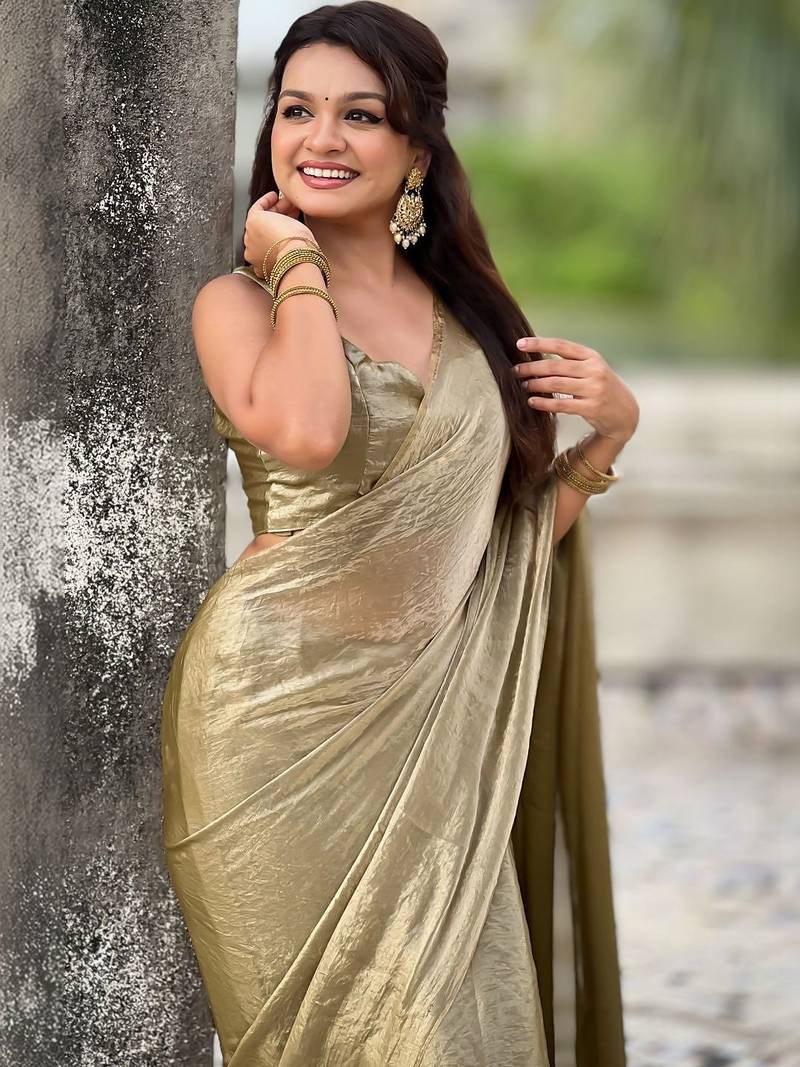 Olive golden beige shimmer satin tissue saree with golden tassels