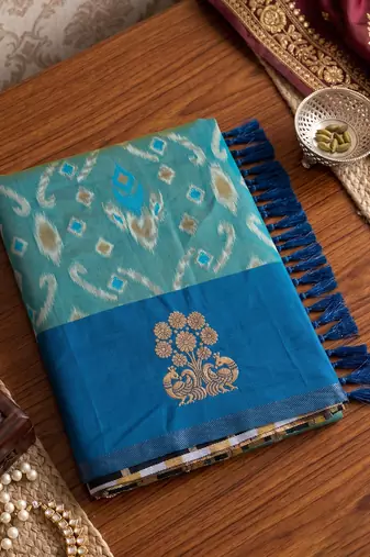 women's sky blue soft pochampally saree with royal blue border for festive & wedding party wear
