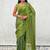 Lime green shimmer satin tissue saree with golden tassels