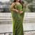 Lime green shimmer satin tissue saree with golden tassels