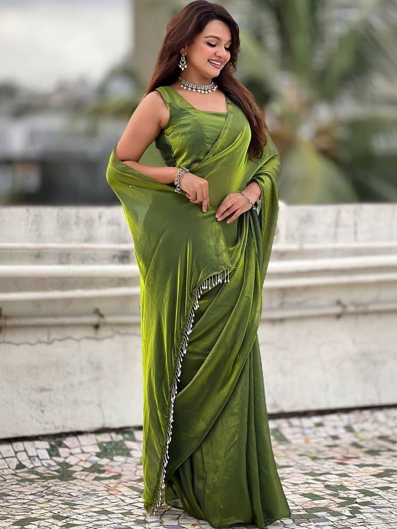 Lime green shimmer satin tissue saree with golden tassels