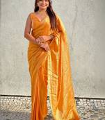 Mustard yellow shimmer satin tissue saree with golden tassels