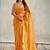 Mustard yellow shimmer satin tissue saree with golden tassels