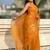 Mustard yellow shimmer satin tissue saree with golden tassels