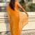 Mustard yellow shimmer satin tissue saree with golden tassels