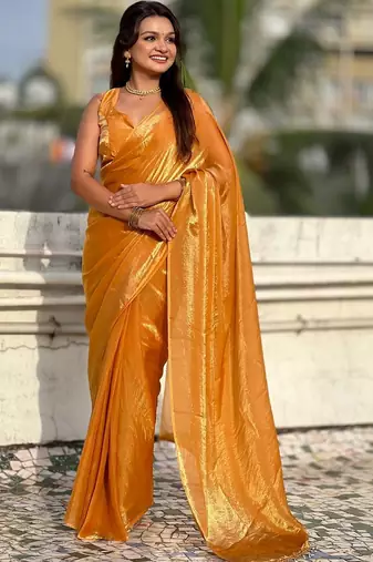 Mustard yellow shimmer satin tissue saree with golden tassels