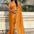Mustard yellow shimmer satin tissue saree with golden tassels